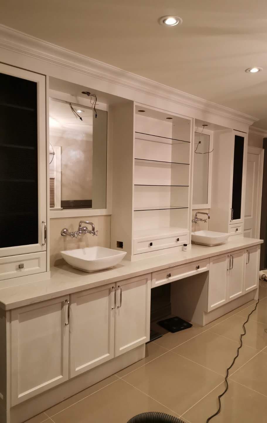 All White Vanity with Duo Sinks and Built in Cabinets